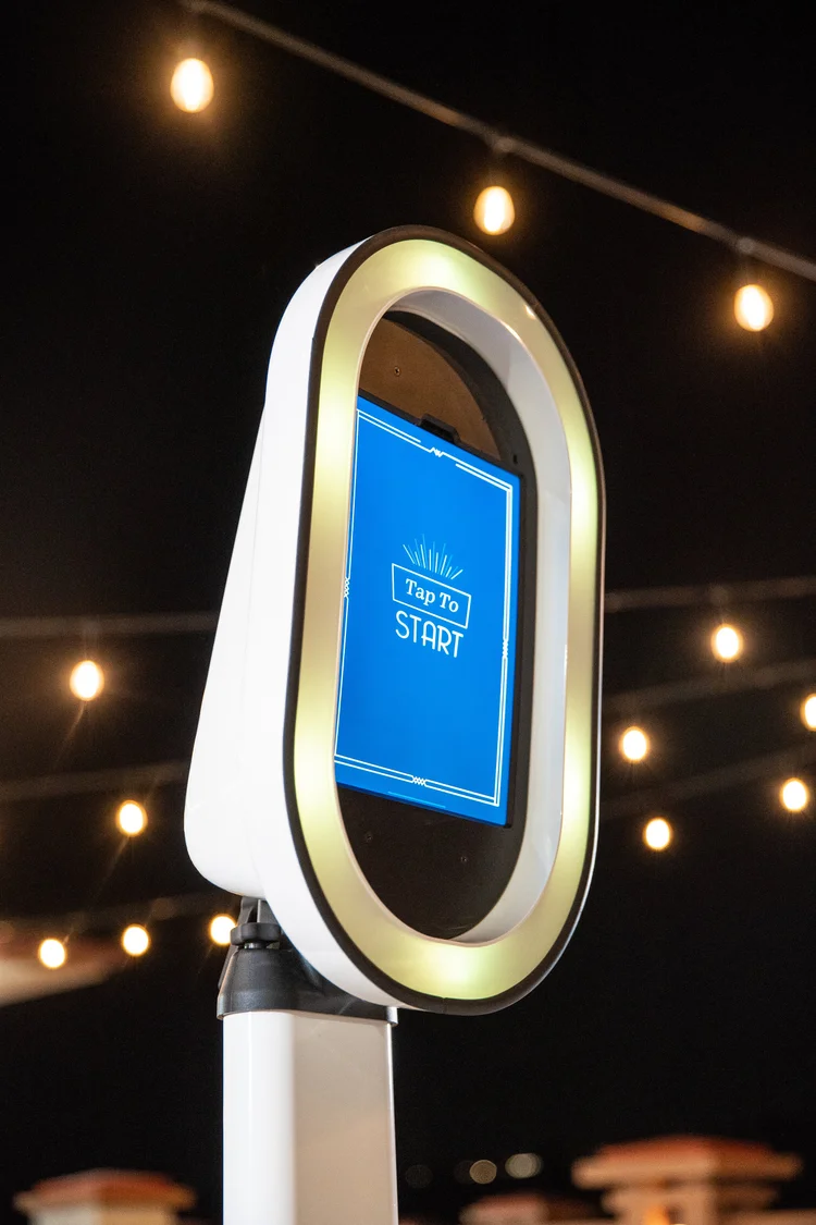 Event photo booth rental Bend Oregon under string lights