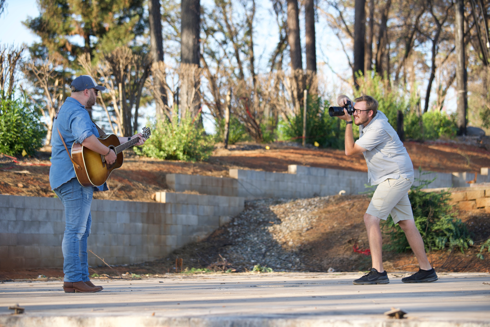 Kyle photographing country artist Nate Smith with a guitar on location