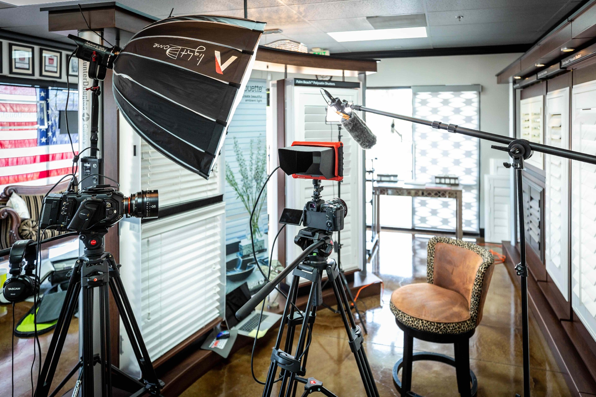 Full commercial video set with cameras, softbox, and boom mic