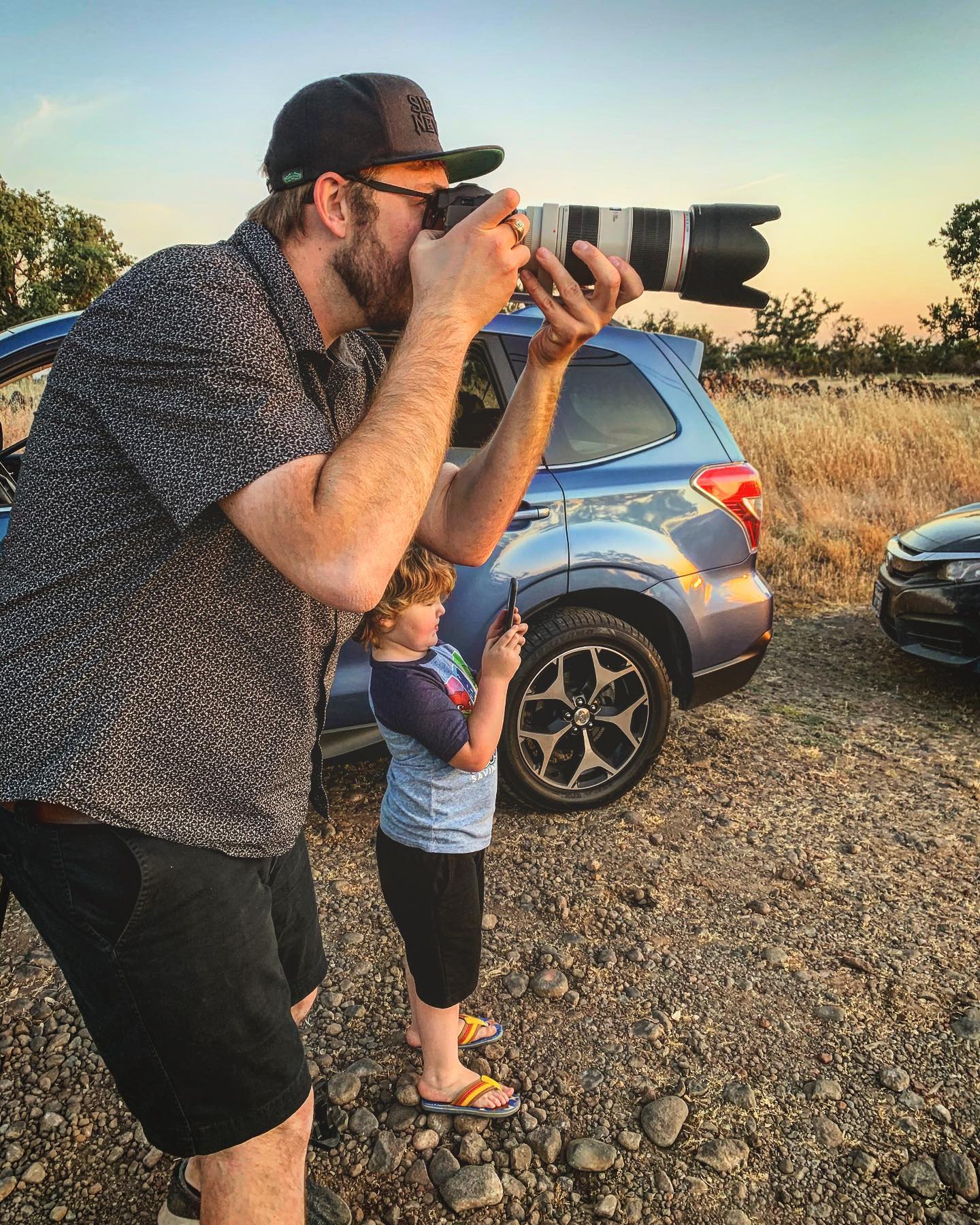 Kyle shooting alongside his son at golden hour