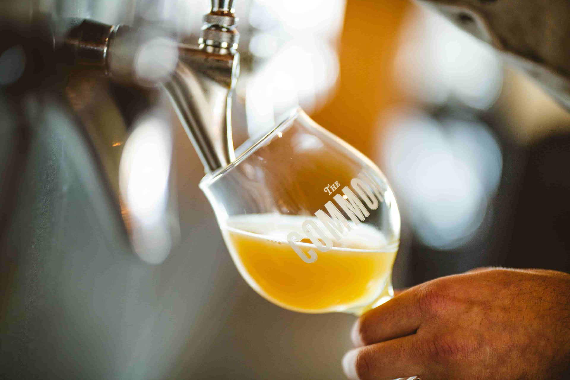 Restaurant photography Bend Commons beer tap pour